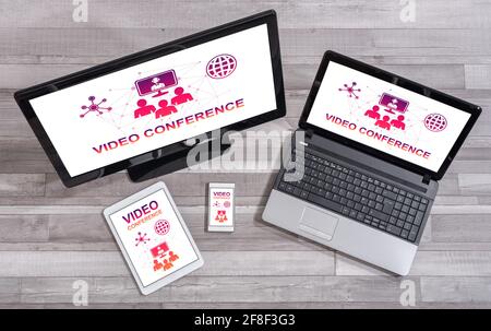 Video conference concept shown on different information technology devices Stock Photo