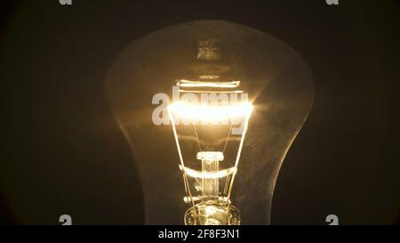 Photo of incandescent bulb on black background Stock Photo