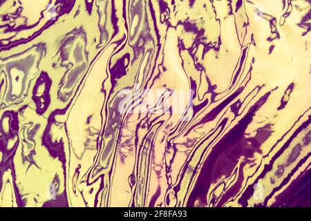 Iridescent background. Holographic wrinkled abstract foil texture. Glittering blurred surface pack. Stock Photo