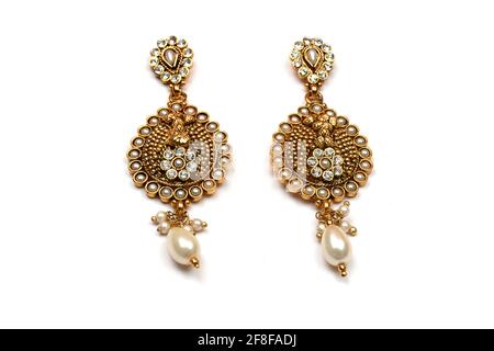 Beautiful Golden pair of earrings, pearls earrings on white background Indian traditional jewellery, Bridal Gold earrings wedding jewellery Stock Photo