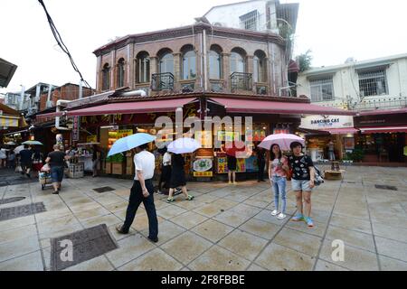 Walking between the beautiful old buildings on Gulangyu island in Xiamen, China. Stock Photo