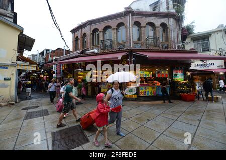 Walking between the beautiful old buildings on Gulangyu island in Xiamen, China. Stock Photo