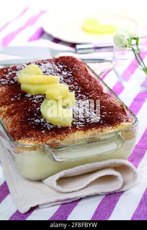 Traditional tiramisù with pineapple and coconut Stock Photo