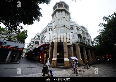 Walking between the beautiful old buildings on Gulangyu island in Xiamen, China. Stock Photo