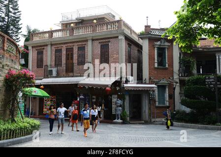 Walking between the beautiful old buildings on Gulangyu island in Xiamen, China. Stock Photo