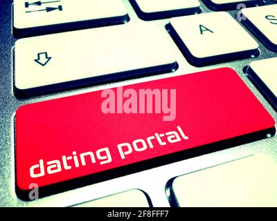 A computer and key for dating portal Stock Photo