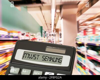 Supermarket, price tag and stamp VAT cut Stock Photo