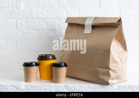 Group shot of biodegradable and recyclable food packaging on white background, paper plates, cups, containers, bags, no logos Stock Photo