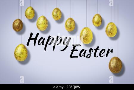 Golden shiny eggs and text - Happy Easter. Easter concept Stock Photo