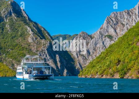 Ferry cruising lake Koman in Albania Stock Photo