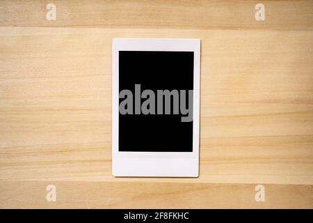 instant photo frame on wood background Stock Photo