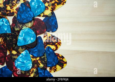 guitar picks on wood background Stock Photo