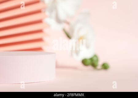 Podium stand pedestal for product presentation, coral pink mockup for branding. Stock Photo