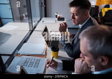 Business colleagues working together on project in office Stock Photo