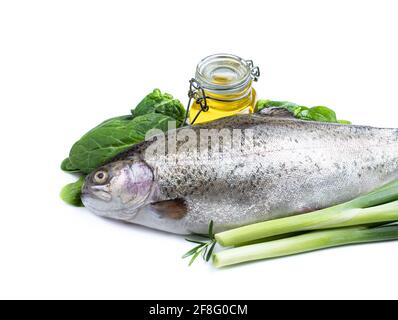 Fresh  rainbow trout with herbs and olive oil isolated on white Stock Photo