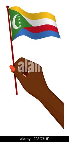 Female hand gently holds small flag of Comoros islands. Holiday design element. Cartoon vector on white background Stock Vector