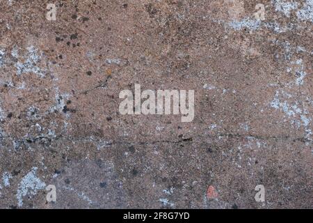 The texture of the cement-covered brickwork of an old, abandoned caponier. Cracked cement surface. Stock Photo