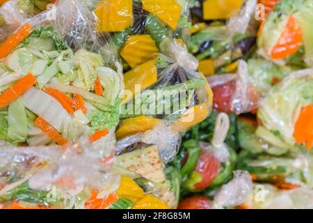 colorful packs of sliced market vegetables.Colorful chopped vegetables in plastic bags. Stock Photo