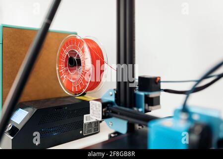 Stock photo of modern 3d printer’s parts with blue and red cable. Stock Photo