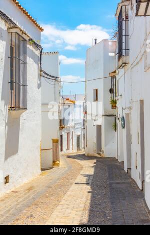 Whitewashed street of the old town of Arcos de la Frontera, one of pueblos blancos, in Spain Stock Photo