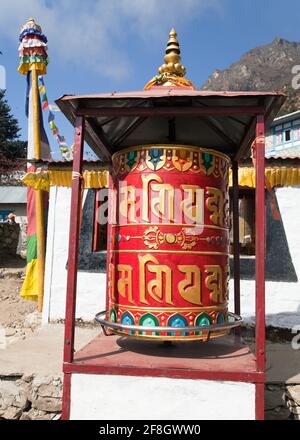 Prayer wheel in Tamo - monastery in Khumbu valley on three passes trek, Mount Everest area, Sagarmatha national park, Nepal Stock Photo