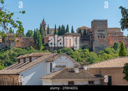 Alhambra palace viewed from a street in Albaicin district in Granada, Spain Stock Photo