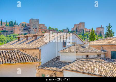 Alhambra palace viewed from a street in Albaicin district in Granada, Spain Stock Photo