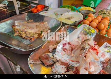 Disgusting unfamiliar Thai food and Chinese cuisine in street food market in China Town Bangkok Thailand. Stock Photo