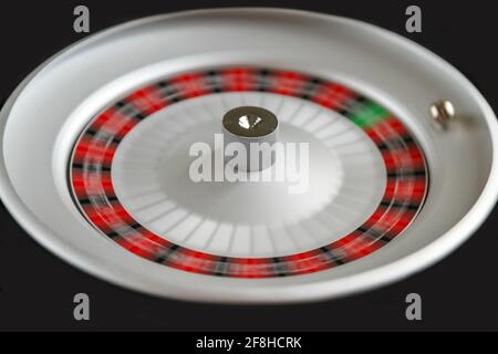 Casino roulette wheel isolated on Black background Stock Photo