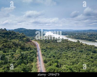 Beautiful drone aerial view of Amazon rainforest trees landscape, BR 163 road and Jamanxim river Para, Brazil. Concept of nature, ecology, environment Stock Photo