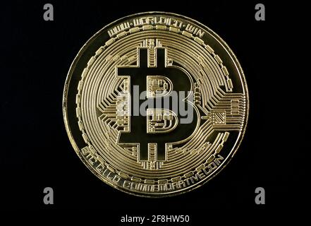 gold plated bitcoin coin on black background Stock Photo