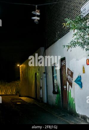 Shoes hanging from telephone wire Stock Photo