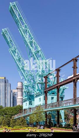 Cranes as sculpture over Domino Park in Williamsburg, Brooklyn, on the East River. Stock Photo