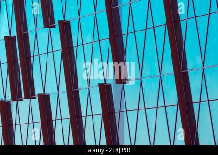 Abstract glass surface with geometric triangular shapes and dark inserts of other acute-angled shapes Stock Photo