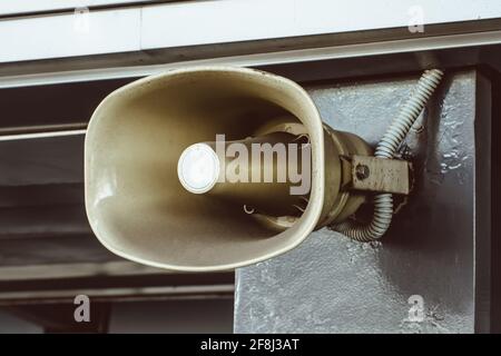Shout, a megaphone installed on the wall of the building, for voice information messages of the people Stock Photo