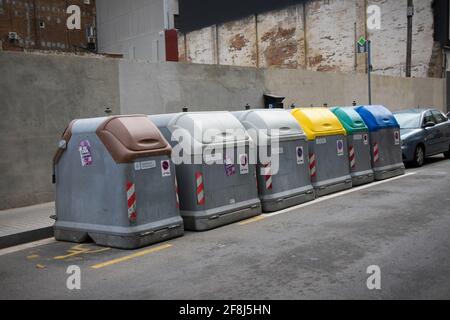 Recycling bins in a street. Brown, organic, grey, all, yellow, plastic, green, glass, blue, paper. Barcelona, Catalonia, Spain. Stock Photo