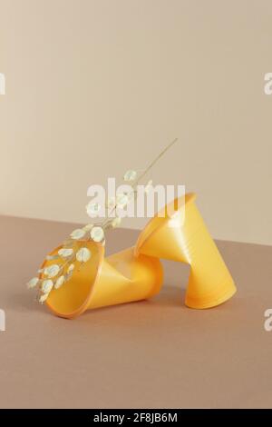 Crumpled empty plastic cups on monochrome background, isometric view, plastic waste, waste recycling, eco friendly packaging, sustainable industry con Stock Photo