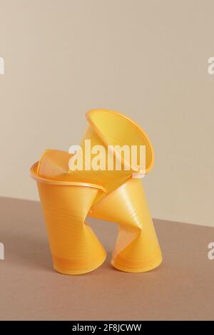 Crumpled empty plastic cups on monochrome background, isometric view, plastic waste, waste recycling, eco friendly packaging, sustainable industry con Stock Photo