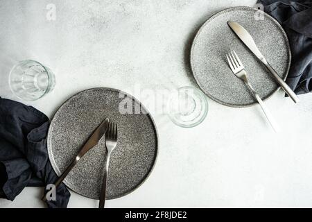 Overhead view of two minimalistic place settings on a  table Stock Photo