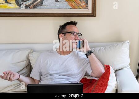 Portrait of a good looking man working at home Stock Photo