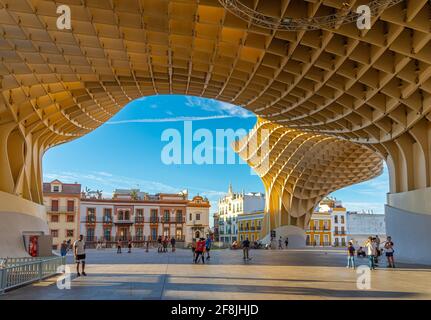 SEVILLA, SPAIN, JUNE 24, 2019: People are strolling through pillars of Setas de Sevilla in Spain