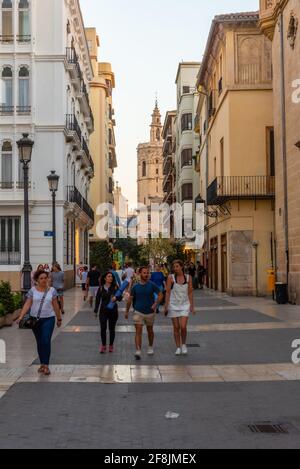 VALENCIA, SPAIN, JUNE 17, 2019: Narrow street leading to Torre del Micalet bell tower of the cathedral of Valencia, Spain Stock Photo