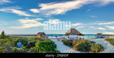 Panoramic view of tropical beach resort by the sea with huts, bars and shading areas in Cayo Santa Maria , Cuba Stock Photo