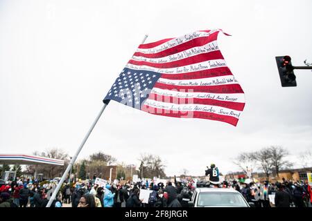 Brooklyn Center, United States. 13th Apr, 2021. Protestors march near the Brooklyn Center Police Department on April 13, 2021 in Brooklyn Center, Minnesota after the killing of Daunte Wright during a traffic stop near Minneapolis. Photo: Chris Tuite/ImageSPACE/Sipa USA Credit: Sipa USA/Alamy Live News Stock Photo