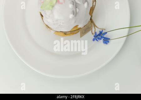 Orthodox cake on a plate with a blue flower top view on a white background Stock Photo