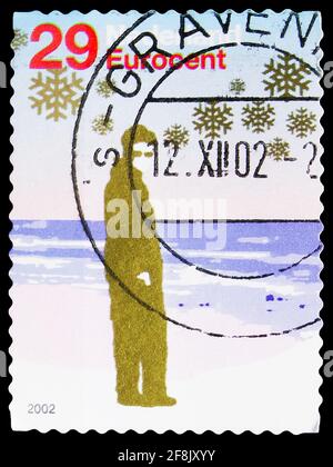MOSCOW, RUSSIA - OCTOBER 7, 2019: Postage stamp printed in Netherlands shows Persons in winter landscape,  serie, 29 ct - Euro cent, circa 2002 Stock Photo