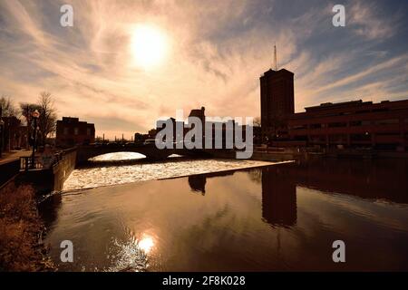 Aurora, Illinois, USA. The dam on the Fox River just below New York Avenue divides calm from white water as it flow through downtown Aurora. Stock Photo