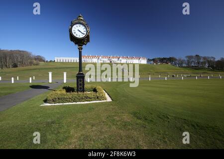 Scotland, Turnberry, Ayrshire, 12 April 2021. Large clock outside Turnberry Club house with the name of Trump on it  & the hotel in the background Stock Photo