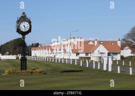 Scotland, Turnberry, Ayrshire, 12 April 2021. Large clock outside Turnberry Club house with the name of Trump on it & lodges in background Stock Photo