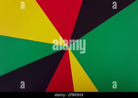 Red, yellow and green colors papers on te black background. Black History Month concept. Flat lay. Copy space. Stock Photo